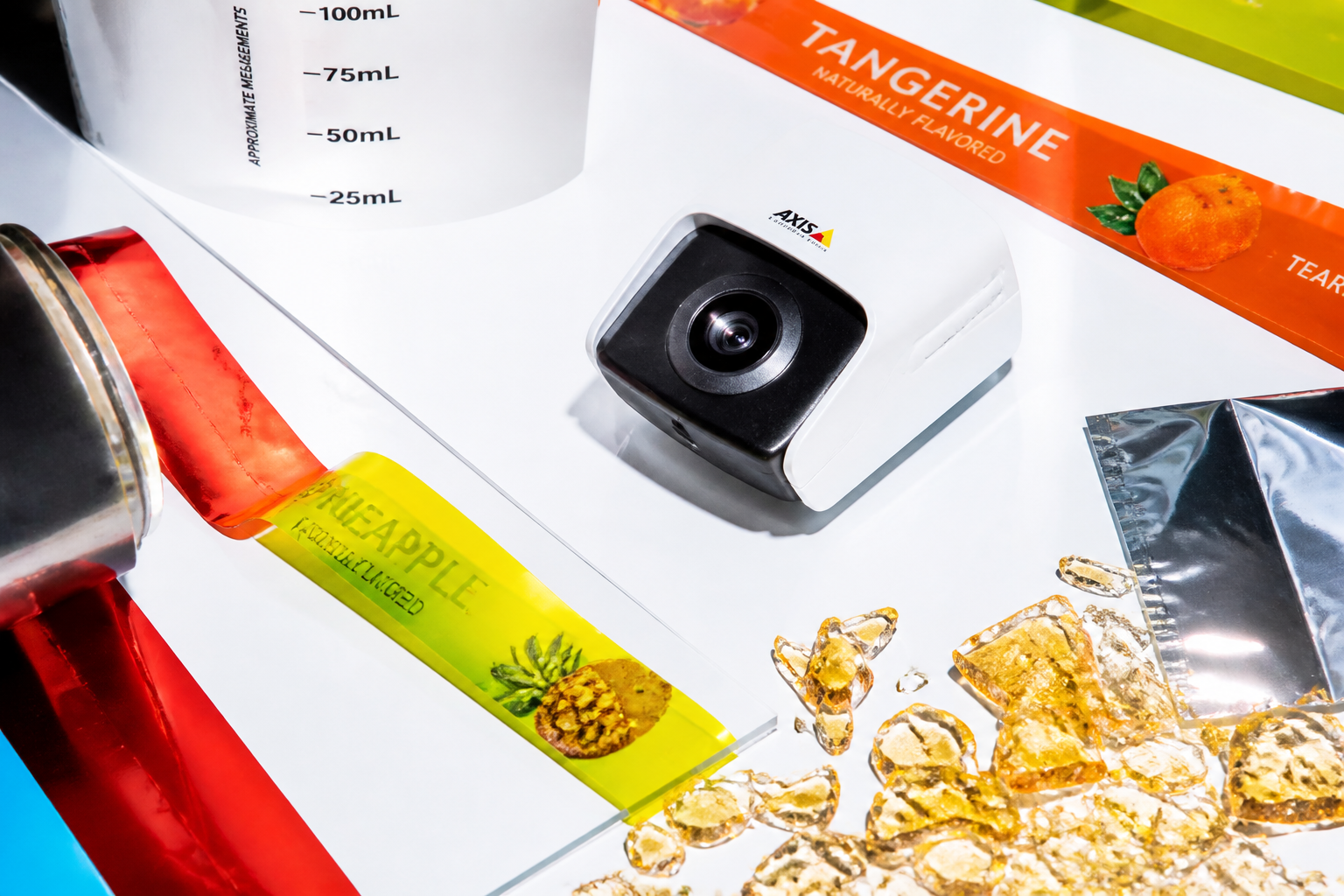 Compact security camera among glossy synthetic production materials